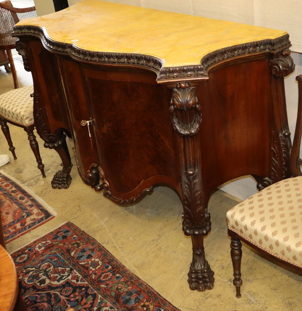 A George III style serpentine mahogany commode with faux marble top, W.145cm, D.59cm, H.101cm